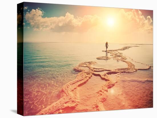 Silhouette of Young Woman Walking on Dead Sea at Sunrise-vvvita-Premier Image Canvas