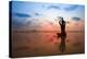 Silhouette Young Woman Practicing Yoga On The Beach At Sunset-De Visu-Stretched Canvas