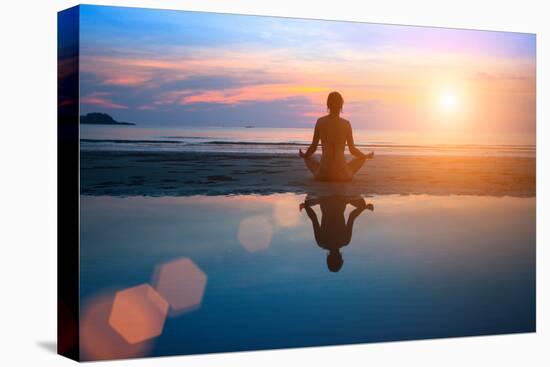 Silhouette Young Woman Practicing Yoga on the Beach at Sunset-De Visu-Premier Image Canvas