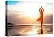 Silhouette Young Woman Practicing Yoga on the Beach at Sunset-De Visu-Premier Image Canvas