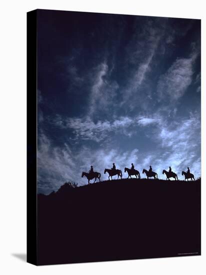 Silhouetted Cowboys During Round Up at Trinchera Ranch-Loomis Dean-Premier Image Canvas