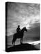 Silhouettes of Cowboy Mounted on Horse-Allan Grant-Premier Image Canvas