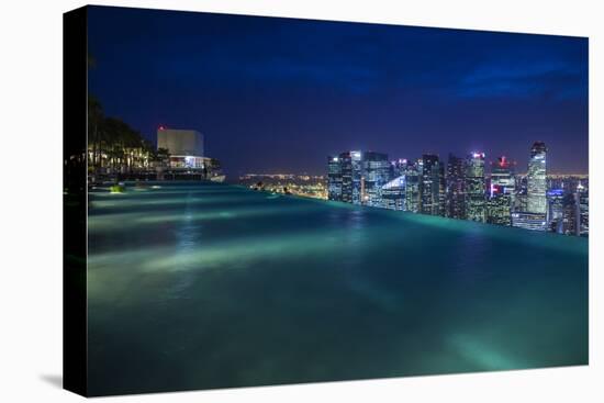 Singapore, Rooftop Swimming Pool at Dusk Overlooks the City-Walter Bibikow-Premier Image Canvas