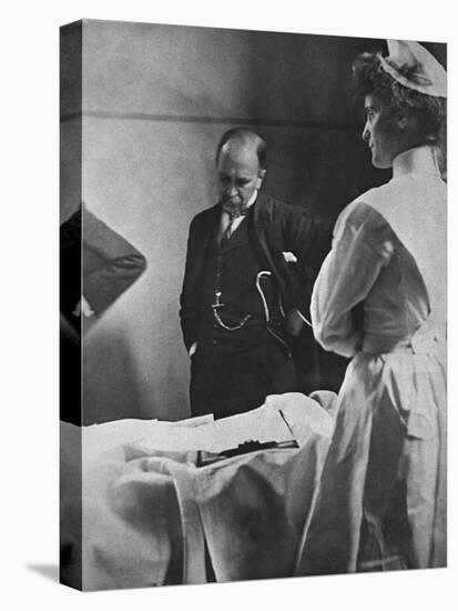 Sir William Osler Reading a Patient's Chart at Bedside as a Nurse Watches, Ca. 1903-null-Stretched Canvas