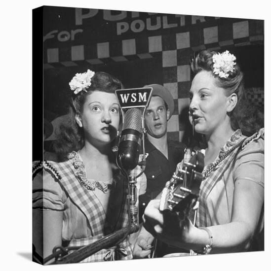 Sisters Performing at the Microphone at the Grand Ole Opry-Ed Clark-Premier Image Canvas