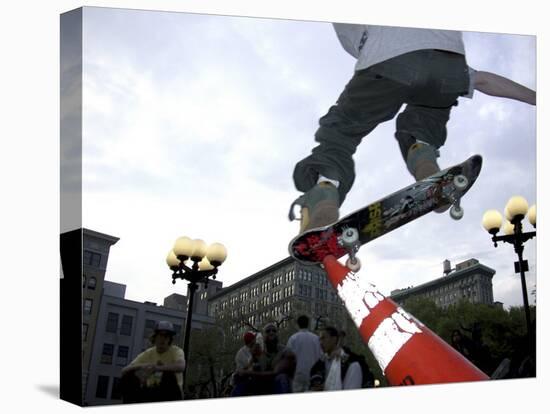 Skateboarder in Midair Knocking Over a Cone-null-Premier Image Canvas