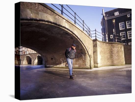 Skater on Frozen Canal, Amsterdam, Netherlands-Michele Molinari-Premier Image Canvas