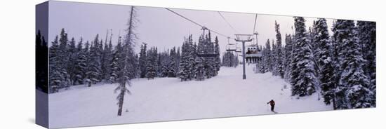 Ski Lift Passing over a Snow Covered Landscape, Keystone Resort, Keystone, Colorado, USA-null-Premier Image Canvas