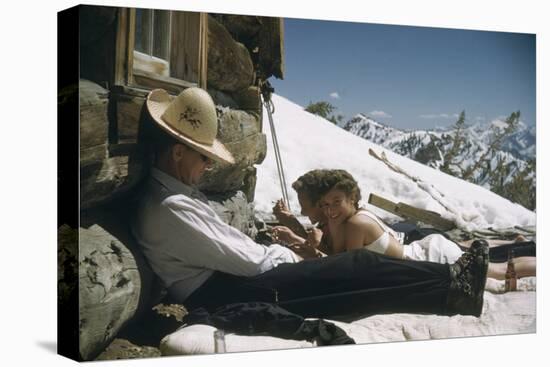 Skiers Smoking, Drinking and Sunbathing at Sun Valley Ski Resort, Idaho, April 22, 1947-George Silk-Premier Image Canvas