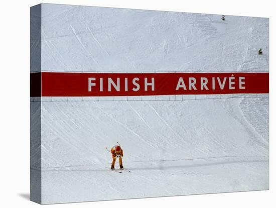 Skiier Arrives at the Finish Line-Paul Sutton-Premier Image Canvas