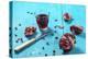 Sliced Pomegranate and a Glass of Pomegranate Juice on Turquoise Wooden Table-Jana Ihle-Premier Image Canvas