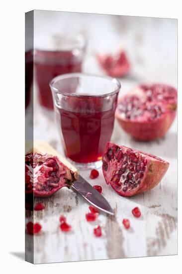 Sliced Pomegranates, Cores and Glass with Pomegranate Juice-Jana Ihle-Premier Image Canvas