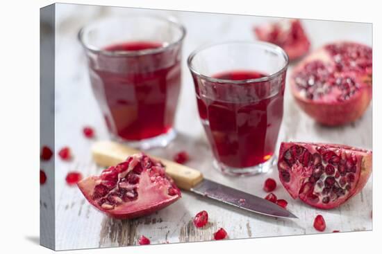 Sliced Pomegranates, Cores and Glasses with Pomegranate Juice-Jana Ihle-Premier Image Canvas