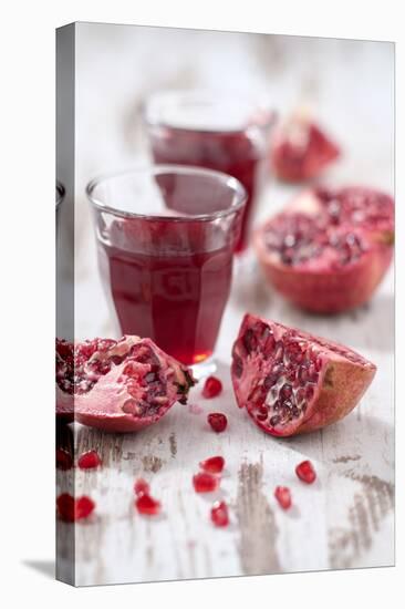 Sliced Pomegranates, Seeds and Glass with Pomegranate Juice-Jana Ihle-Premier Image Canvas