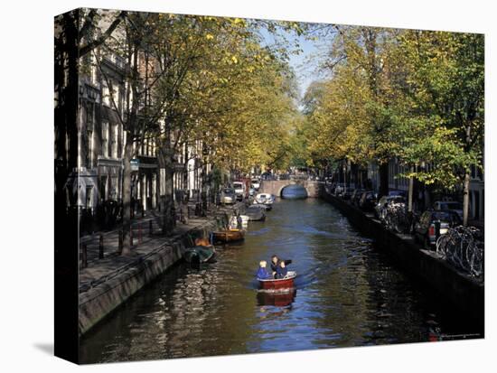 Small Boat on Tree-Lined Oudezijds Achtenburg Wal Canal in the Autumn, Amsterdam, the Netherlands-Richard Nebesky-Premier Image Canvas