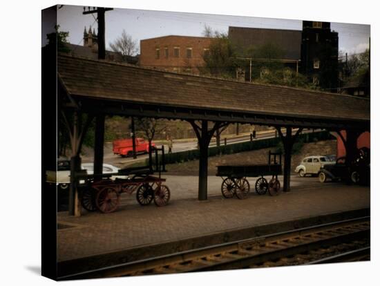 Small Railway Station with Wooden Buckboards for Baggage, Period Cars in Lot-Walker Evans-Premier Image Canvas