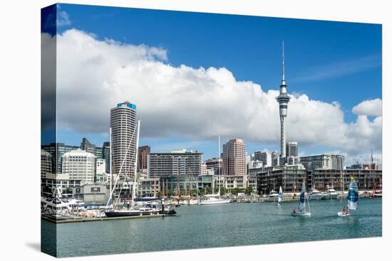 Small sailboats cruise in Auckland harbour in front of the city skyline, Auckland, New Zealand-Logan Brown-Premier Image Canvas