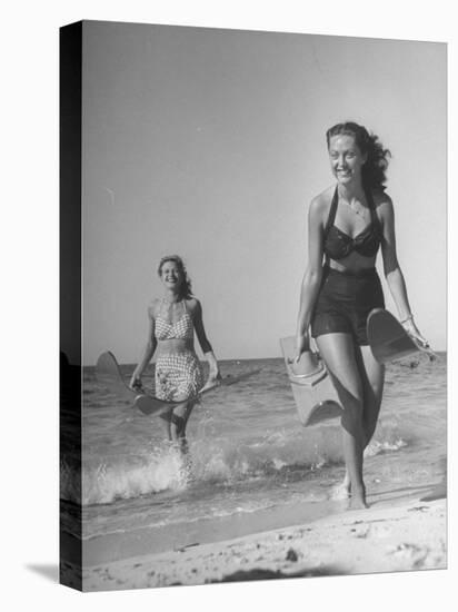 Smiling Girls Carrying Skis Out of the Water onto Beach-null-Premier Image Canvas