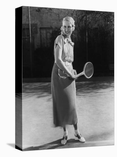 Smiling Woman Playing Tennis-null-Stretched Canvas