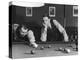 Snooker Player Prepares to Play a Shot as His Partner Looks On-null-Premier Image Canvas