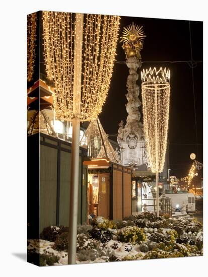 Snow-Covered Flowers, Christmas Decorations and Baroque Trinity Column at Christmas Market, Austria-Richard Nebesky-Premier Image Canvas