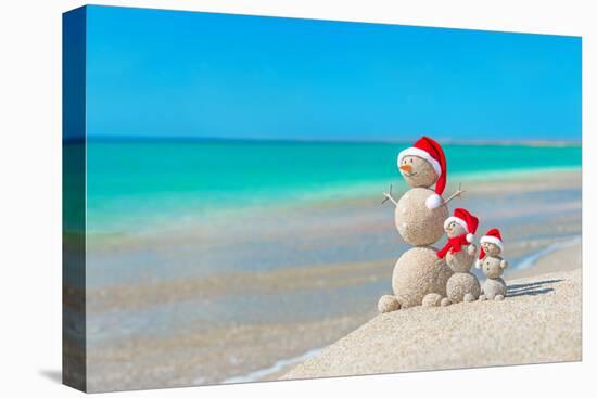 Snowmans Family at Sea Beach in Santa Hat. New Years and Christmas-EMprize-Premier Image Canvas