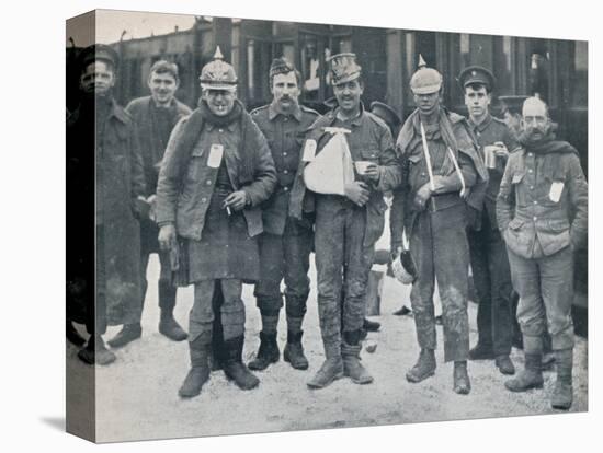 Some cheerful wounded from the Neuve Chapelle fighting, wearing captured German helmets, 1915-Unknown-Premier Image Canvas