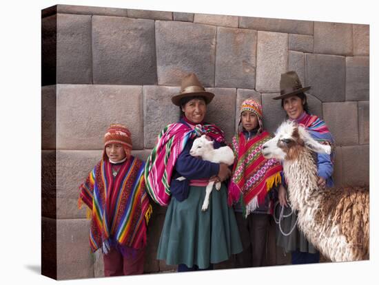 South America, Peru, Cusco. Quechua People in Front of An Inca Wall, Holding a Lamb and a Llama-Alex Robinson-Premier Image Canvas