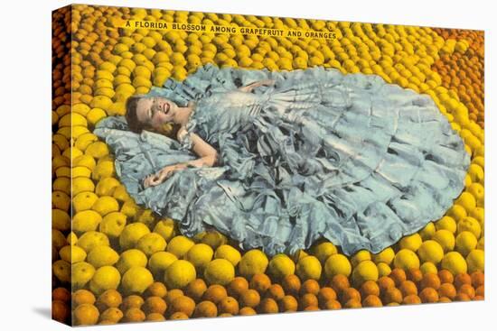 Southern Belle Lying on Oranges, Florida-null-Stretched Canvas
