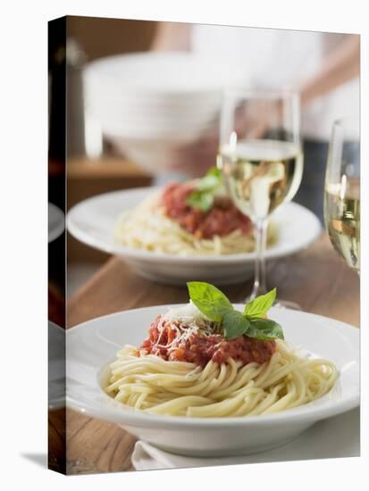 Spaghetti with Tomato Sauce and Glasses of White Wine on Table-null-Premier Image Canvas