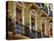 Spain, Sevilla, Andalucia Geraniums hang over iron balconies of traditional houses-Merrill Images-Premier Image Canvas