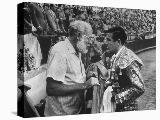 Spanish Matador Antonio Ordonez with Friend, Author Ernest Hemingway in Arena Before Bullfight-Loomis Dean-Premier Image Canvas