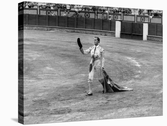 Spanish Matador Luis Miguel Dominguin Doffing His Cap as He Acknowledges the Applause of the Crown-Loomis Dean-Premier Image Canvas