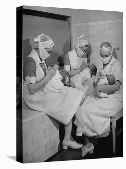 Special Nursery Nurses Wearing Masks as They Bottle-Feed Fully Developed Premature Babies-Hansel Mieth-Premier Image Canvas