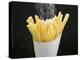 Sprinkling Salt over Chips-null-Premier Image Canvas