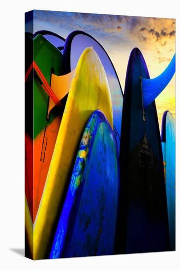 Stacked surf boards at sunset after a day of surf school in Canggu, Bali, Indonesia-Greg Johnston-Premier Image Canvas