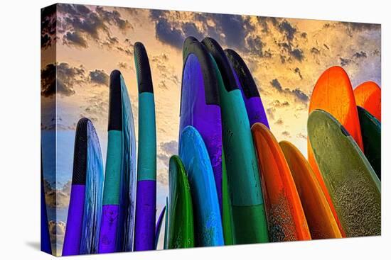 Stacked surf boards at sunset after a day of surf school in Canggu, Bali, Indonesia-Greg Johnston-Premier Image Canvas