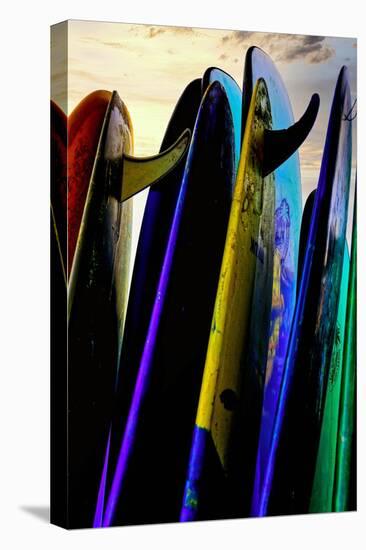 Stacked surf boards at sunset after a day of surf school in Canggu, Bali, Indonesia-Greg Johnston-Premier Image Canvas