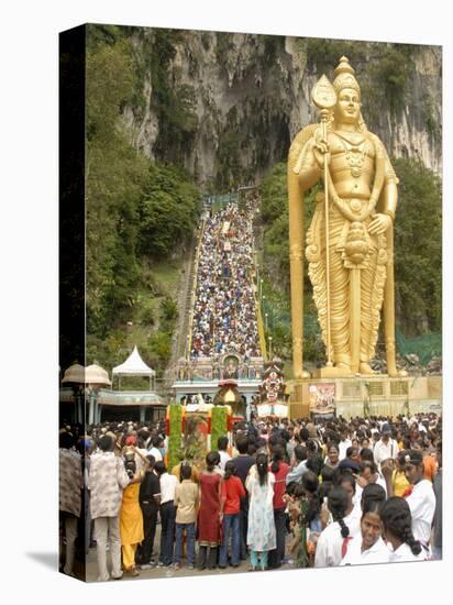 Statue of Hindu Deity with Pilgrims Walking 272 Steps up to Batu Caves, Selangor, Malaysia-Richard Nebesky-Premier Image Canvas