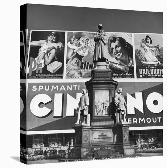 Statue of Leonardo Da Vinci on Top of Monument in Front of Giant Advertising Billboard-Alfred Eisenstaedt-Premier Image Canvas