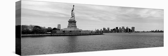 Statue of Liberty with Manhattan Skyline in the Background, Ellis Island, New Jersey-null-Premier Image Canvas