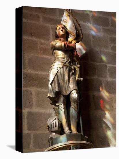 Statue of St. Joan of Arc with Coloured Light from Stained Glass, Church of Notre Dame, Vitre, Brit-Nick Servian-Premier Image Canvas