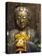 Statue with Offering of Marigold Flowers, Emerald Buddha Temple, Bangkok, Thailand, Southeast Asia-Alain Evrard-Premier Image Canvas
