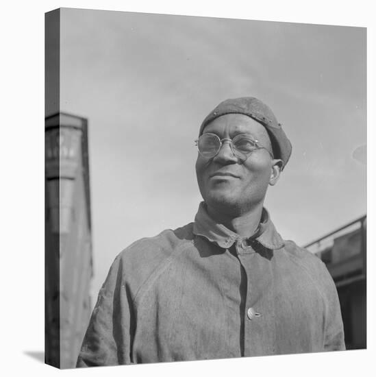 Steel car repairer and rivet driver, at the car shops of the Atchison, Topeka and Santa Fe Railroad-Jack Delano-Premier Image Canvas