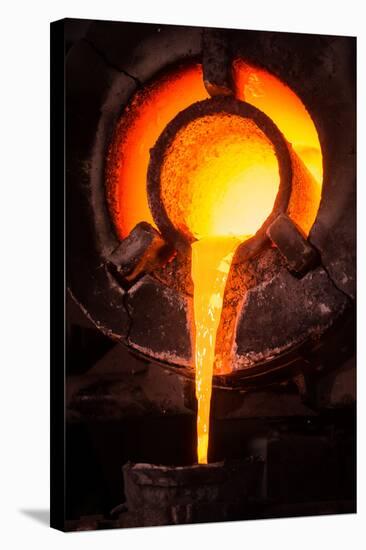 Steel Worker in Protective Clothing Raking Furnace in an Industrial Foundry-FreeProd33-Premier Image Canvas