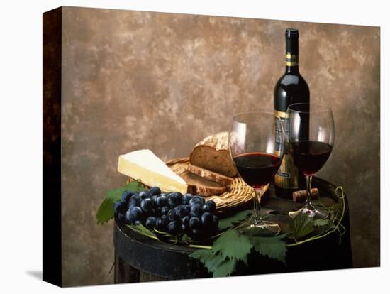 Still Life of Wine Bottle, Wine Glasses, Cheese and Purple Grapes on Top of Barrel-null-Premier Image Canvas