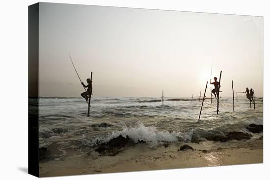 Stilt fisherman in Sri Lanka-Rasmus Kaessmann-Premier Image Canvas