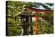 Stone lantern and Torii gate in Fushimi Inari Shrine, Kyoto, Japan-Keren Su-Premier Image Canvas