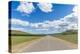Straight road in the Mongolian steppe and clouds in the sky, North Hangay province, Mongolia, Centr-Francesco Vaninetti-Premier Image Canvas