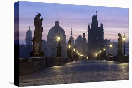 Street lanterns and old statues frame the historical buildings on Charles Bridge at dawn, UNESCO Wo-Roberto Moiola-Premier Image Canvas